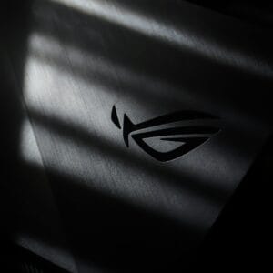 A monochrome photo of the Republic of Gamers logo with dramatic light and shadow effects.