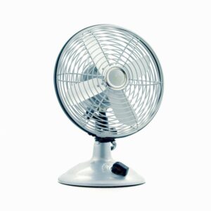 Close-up of a classic electric desk fan against a white background, showcasing retro design.